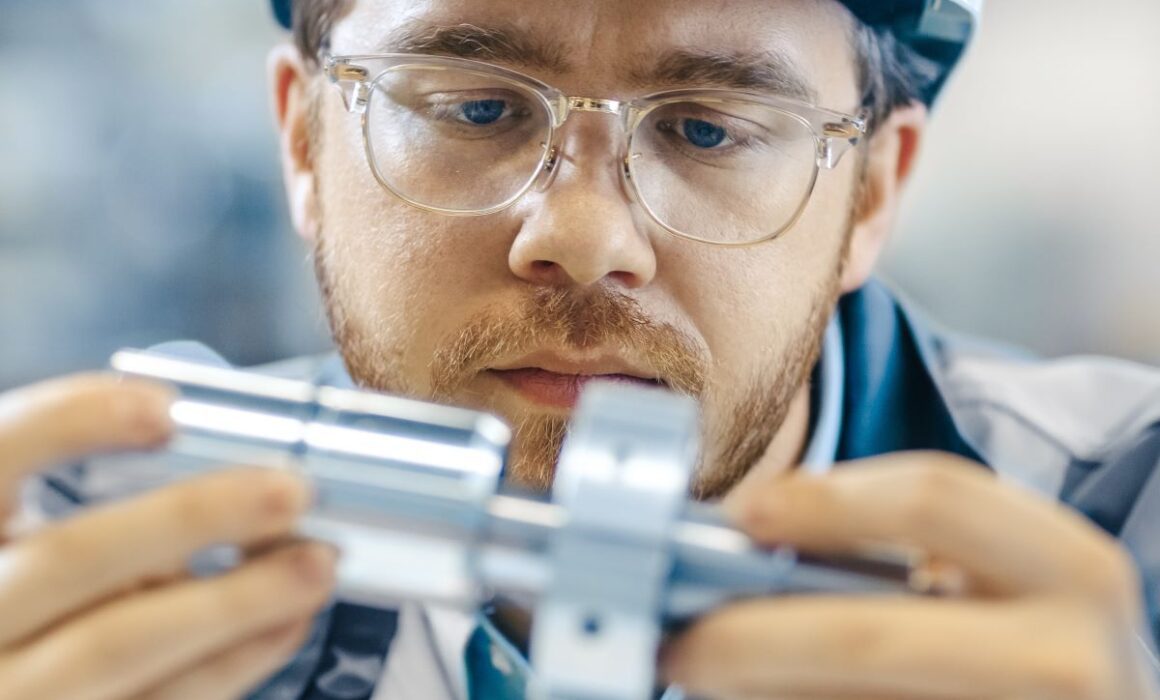 A product safety inspector looking at a piece of equipment